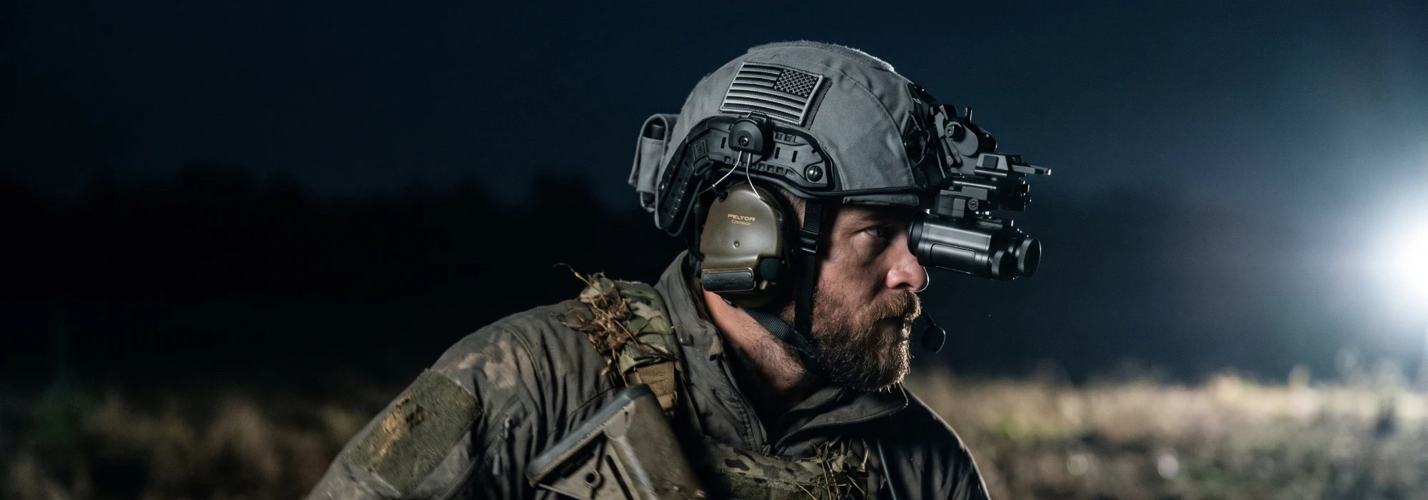 Night Operators PREDATOR thermal monocular on a helmet mount, worn at night