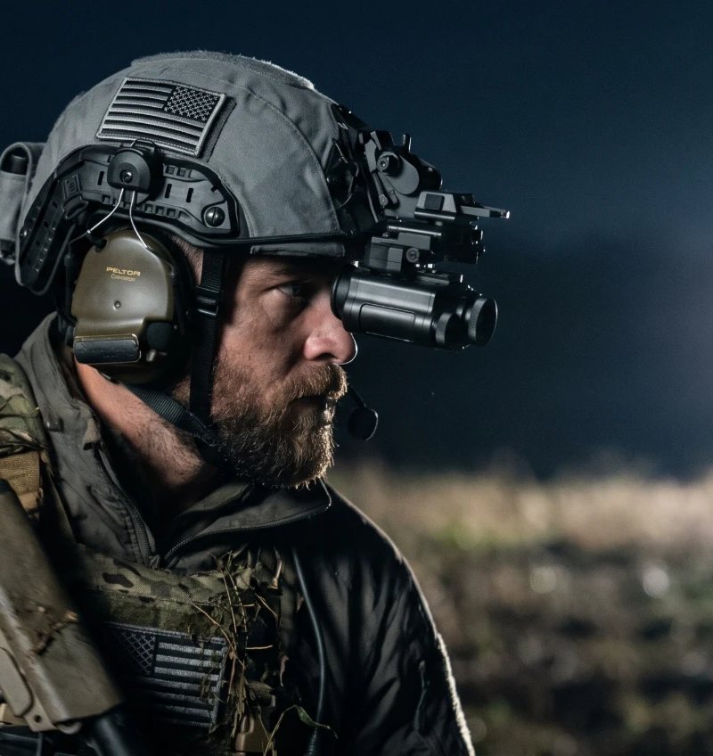 Night Operators PREDATOR thermal monocular on a helmet mount, worn at night
